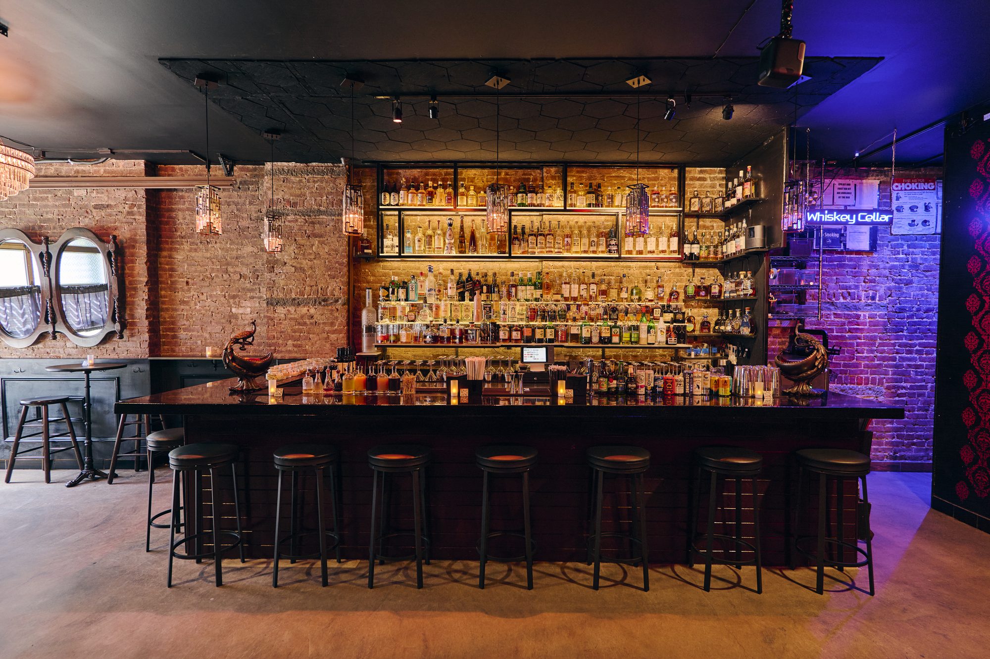 The B Lounge bar with brick walls and oval mirrors