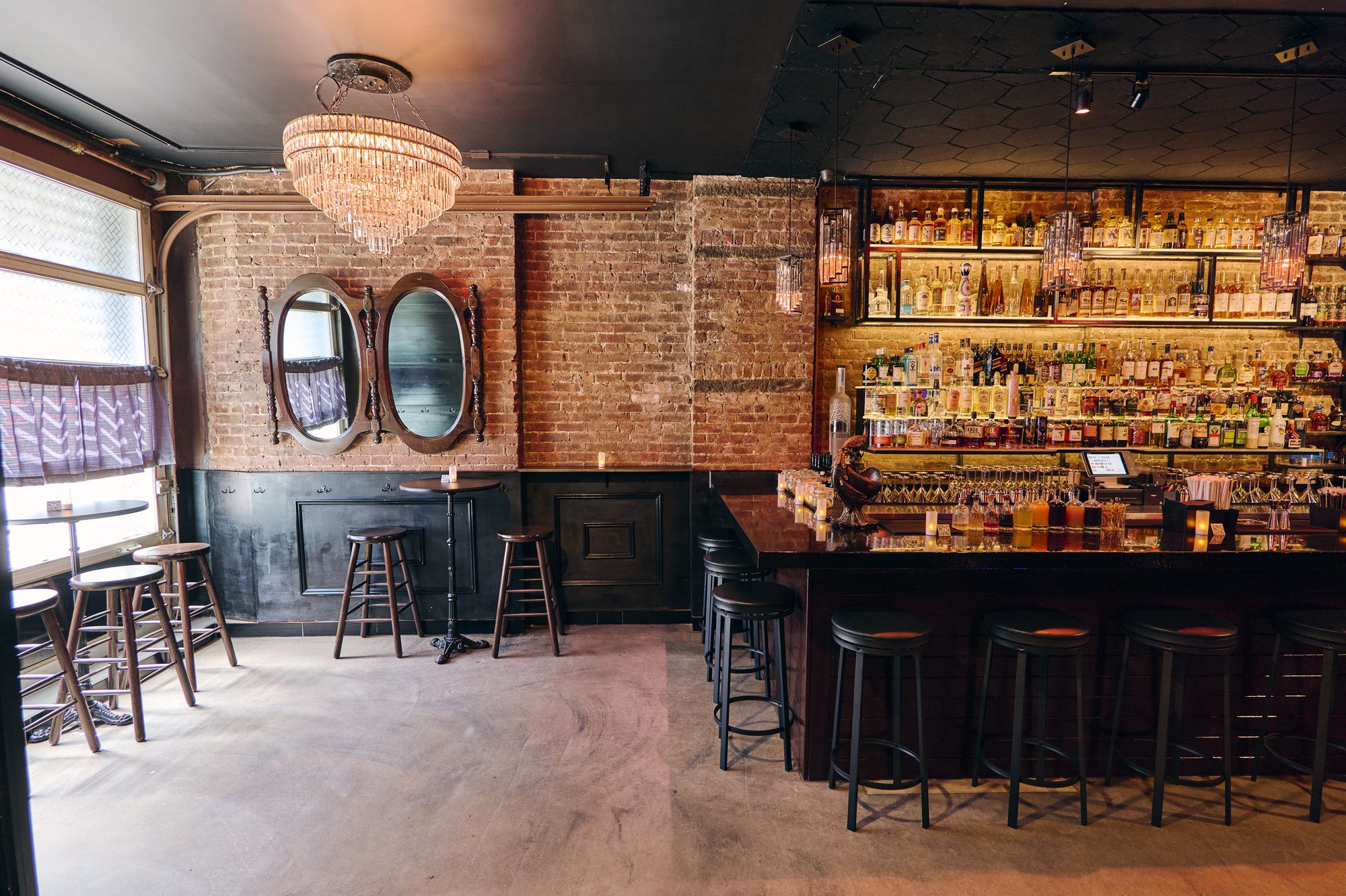 Bar stools and chandelier in the B Lounge