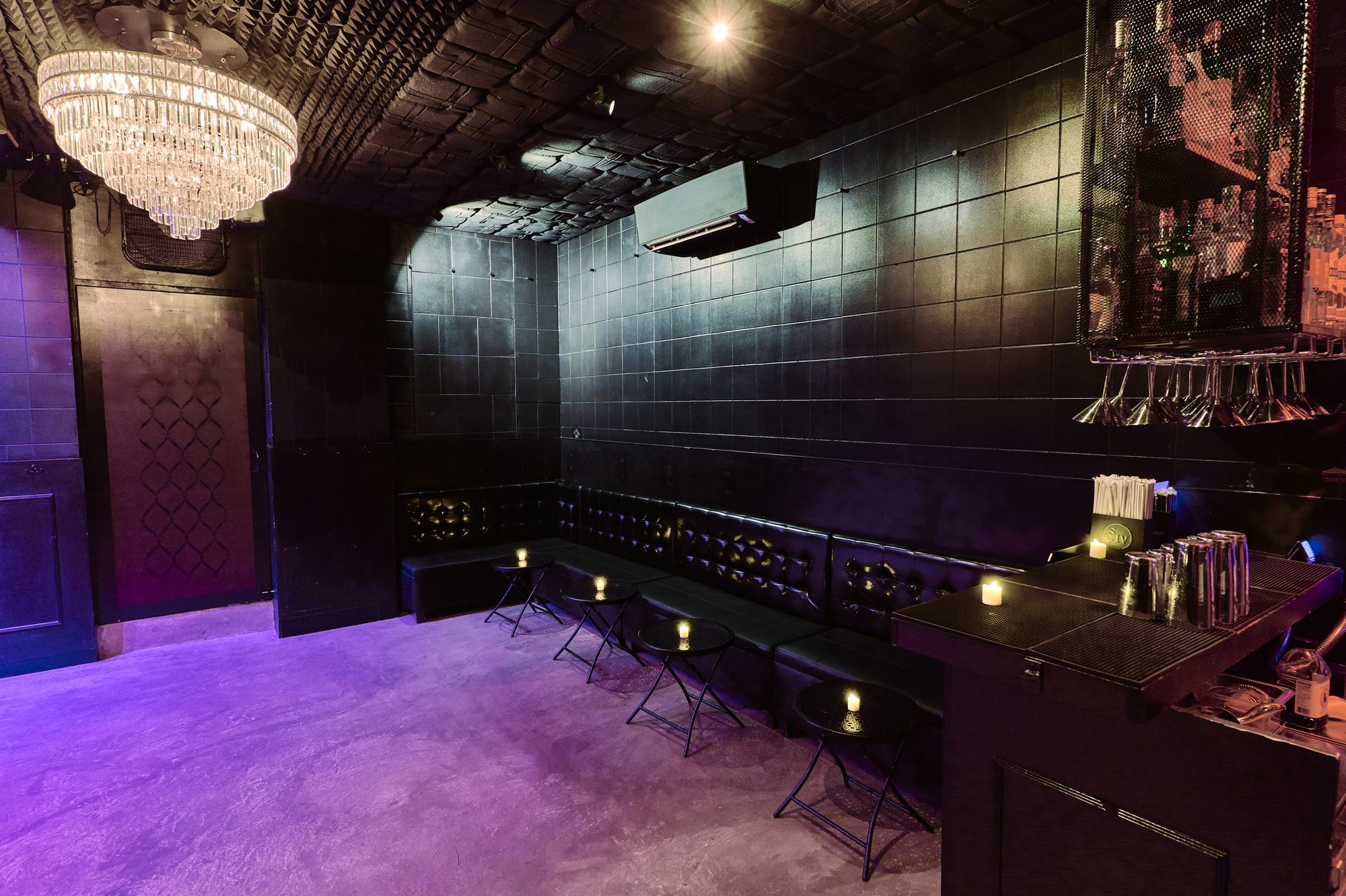 Banquette seating along the tiled walls of the Back Room