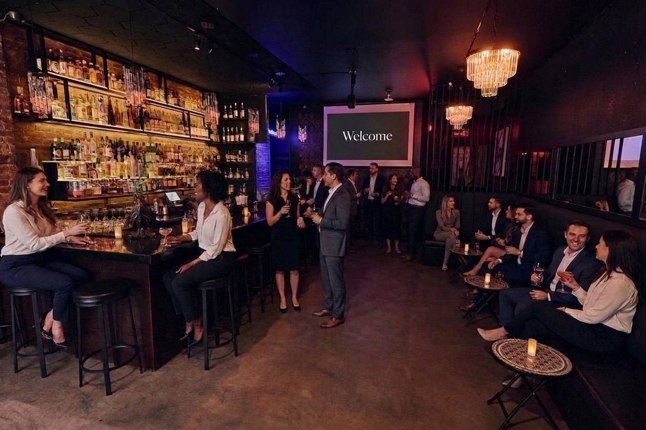 Styled illustration: the B Lounge at B Lounge NYC set up for a company event, a Welcome slide on the projector and colleagues at the bar